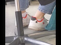 candid feet in white ankle socks and sneakers