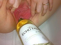 Inserting a open bottle of wine