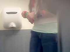 Long hair teen seats in toilet to pee