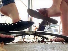 Candid flats dangling under table