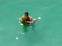 Couple kissing and fucking in the water