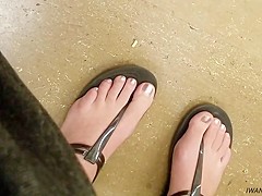 Candid feet in thong sandals