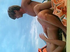 Blond stud ravishing his tanned woman in a rubber boat