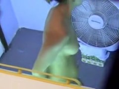 Pretty bimbo in nothing but tiny thong on changing room cam