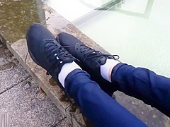Girl wearing Nike sneakers enters mini-pool