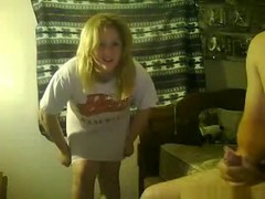 Chubby blonde teases naked, while her bf jerks off in a condom.