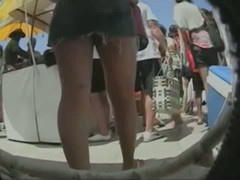 An upskirt spy cam shot of an arousing butt