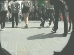 Upskirt porno video of a sexy brunette in a dark skirt and a big butt