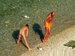 Nude woman swimming and drinking