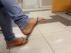 Amateur flip-flop dangling on bank