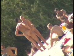 Blonde naked babe with shaved pussy on public beach nudist exposure