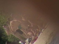 Cute brunette with black thong in the beach video