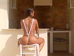 Bronze Tanned Georgina - Pink Micro Bikini Exhibitionist