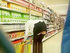 Blonde woman bending over upskirted