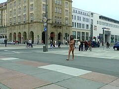 Long haired brunette walks naked in public in hd movie